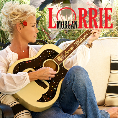 Lorrie Morgan promo photo with guitar