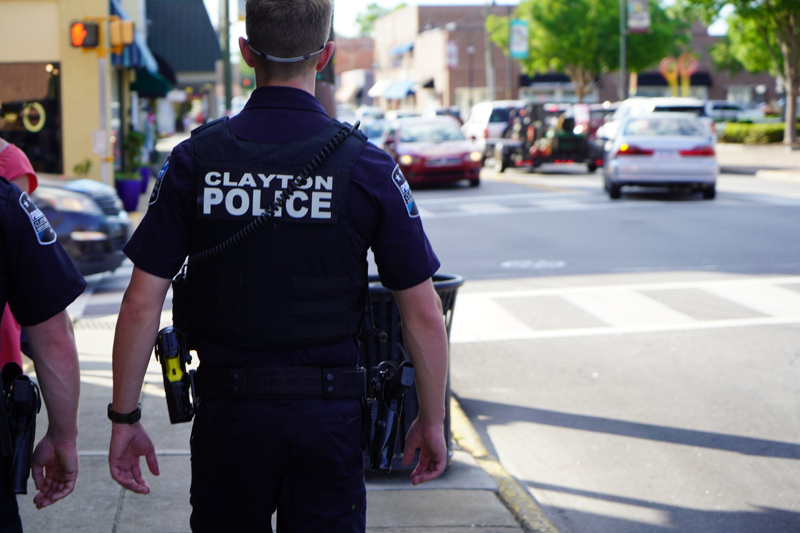 Clayton Police Officers on Patrol along Downtown Street