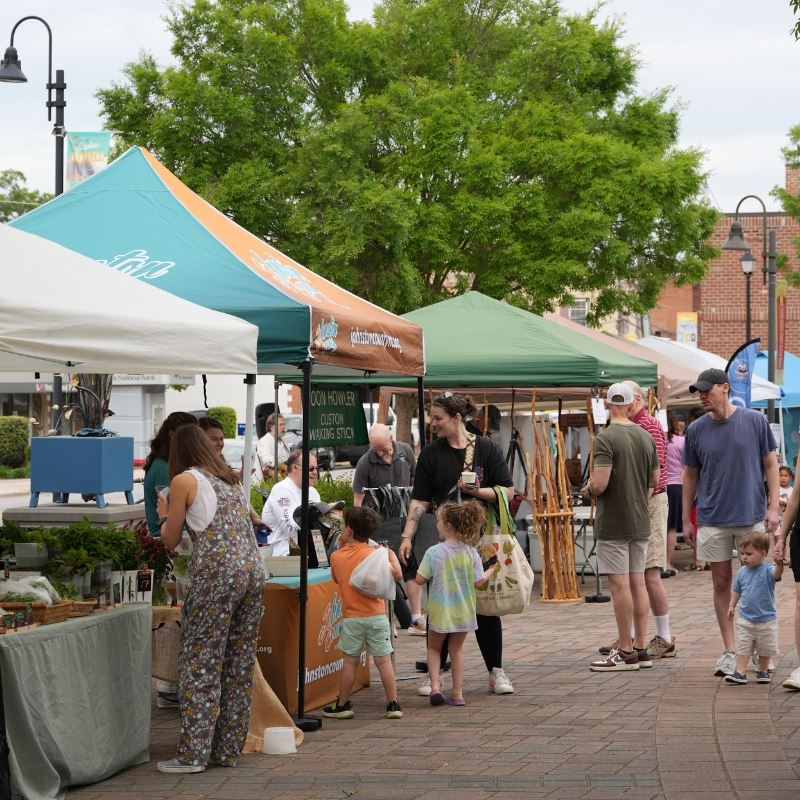 People gather and mingle at Clayton Community and Farmers Market